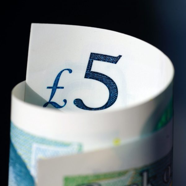 £5 note rolled up - fund raising